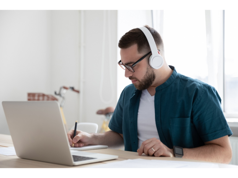 Man with a laptop studying.